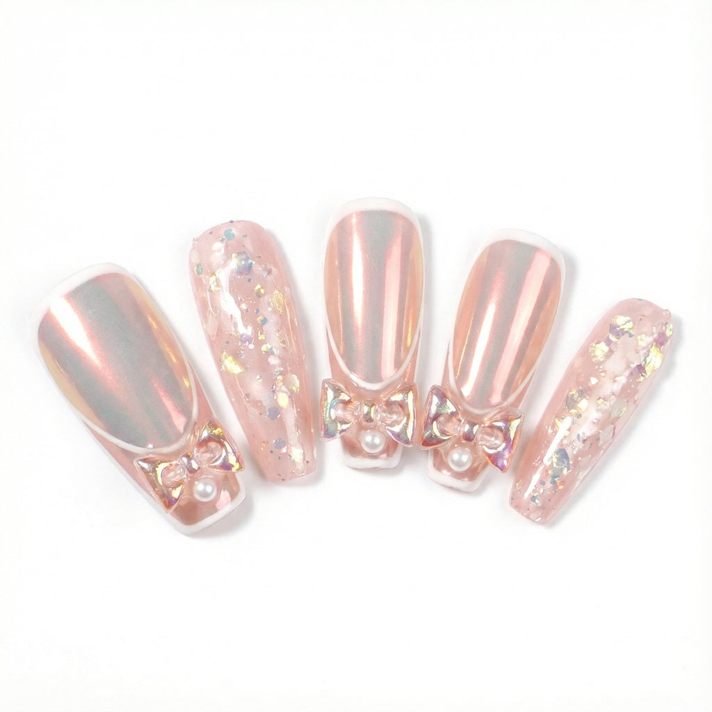 Pink chrome coffin press-on nails with gold holographic foil flakes and bow accents - main product image